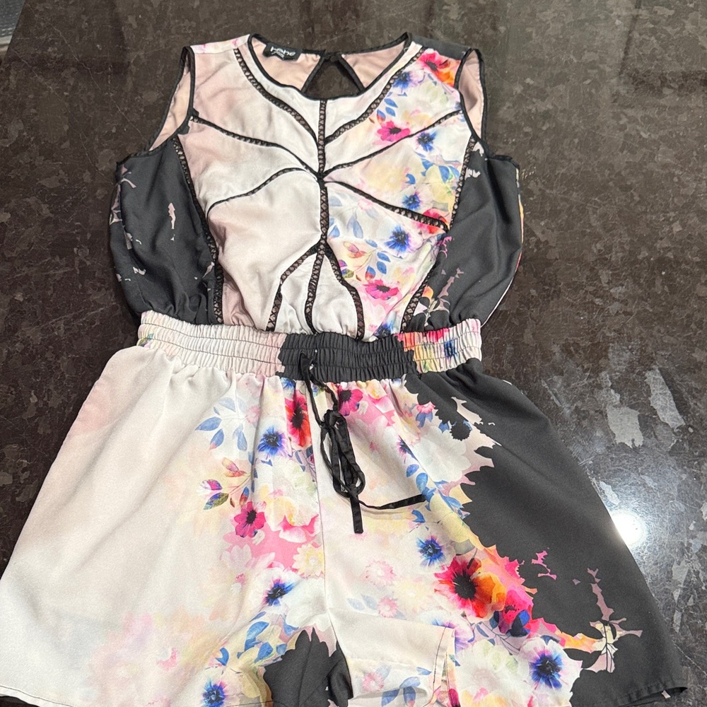Bebe floral romper in excellent condition